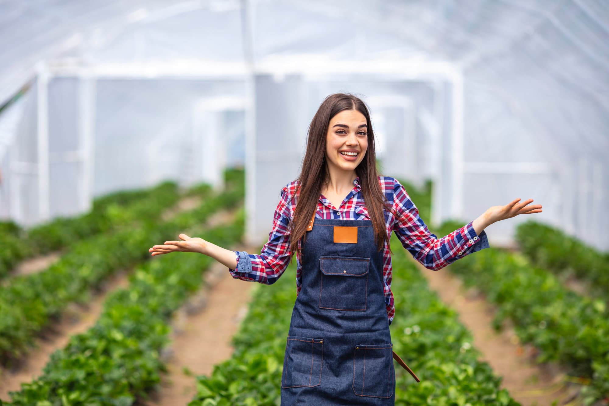 Young,Smiling,Agriculture,Woman,Worker,In,Greenhouse.,Young,Woman,Working